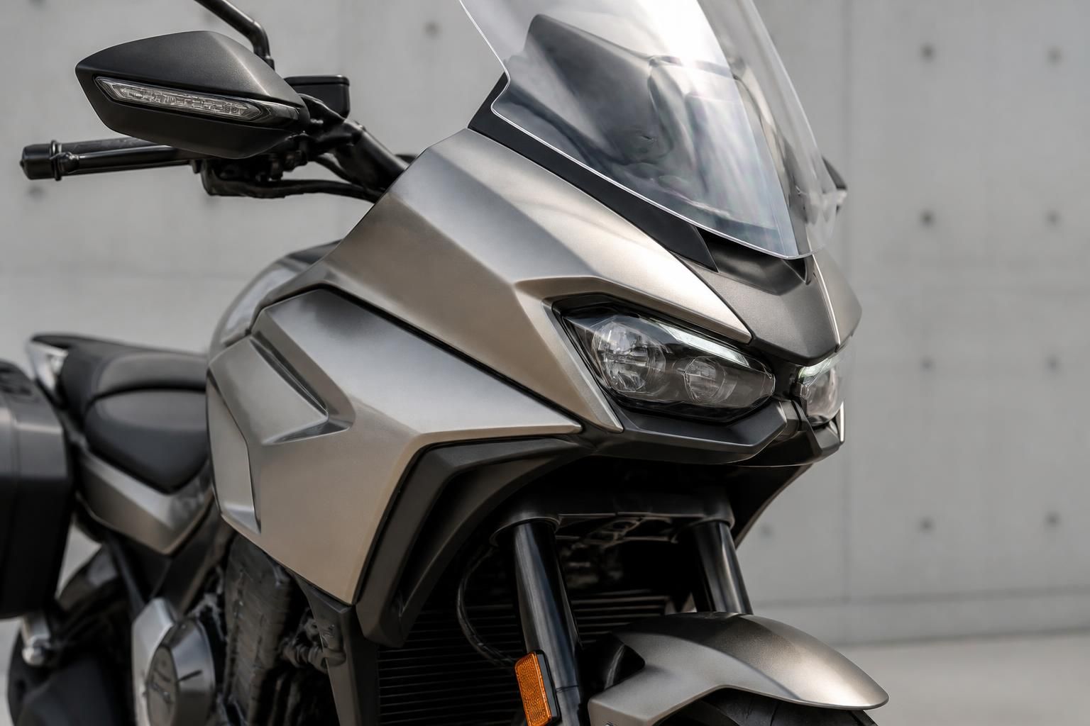 A premium motorcycle in a clean neutral setting.